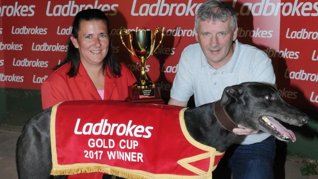 Angela Harrison and Jimmy Wright pose for a photo with Droopys Buick in 2017